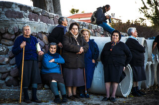 Every day boats come to shore outside the small village Skala Sykamineas. The local women keep a close eye on everything that's going in their village.